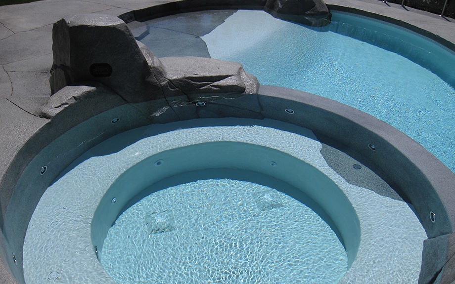 Stunning backyard renovation with swimming pool and hot tub