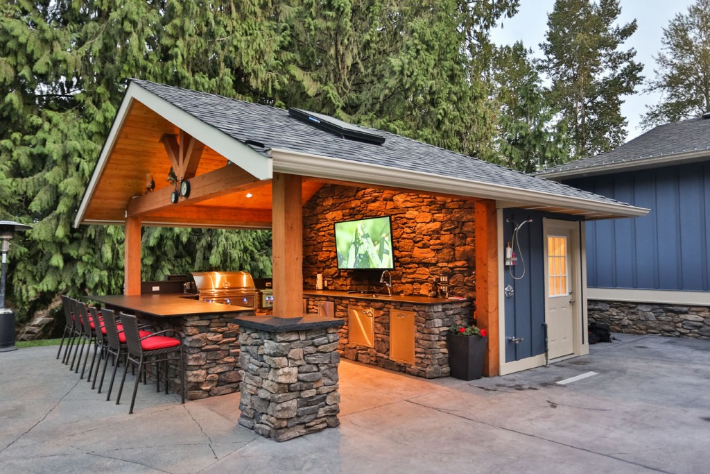 Year-round outdoor kitchen with stainless steel appliances