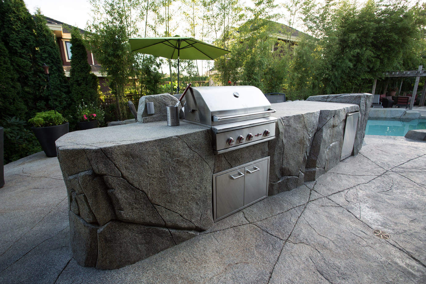 Outdoor kitchen with stainless steel built-in barbeque